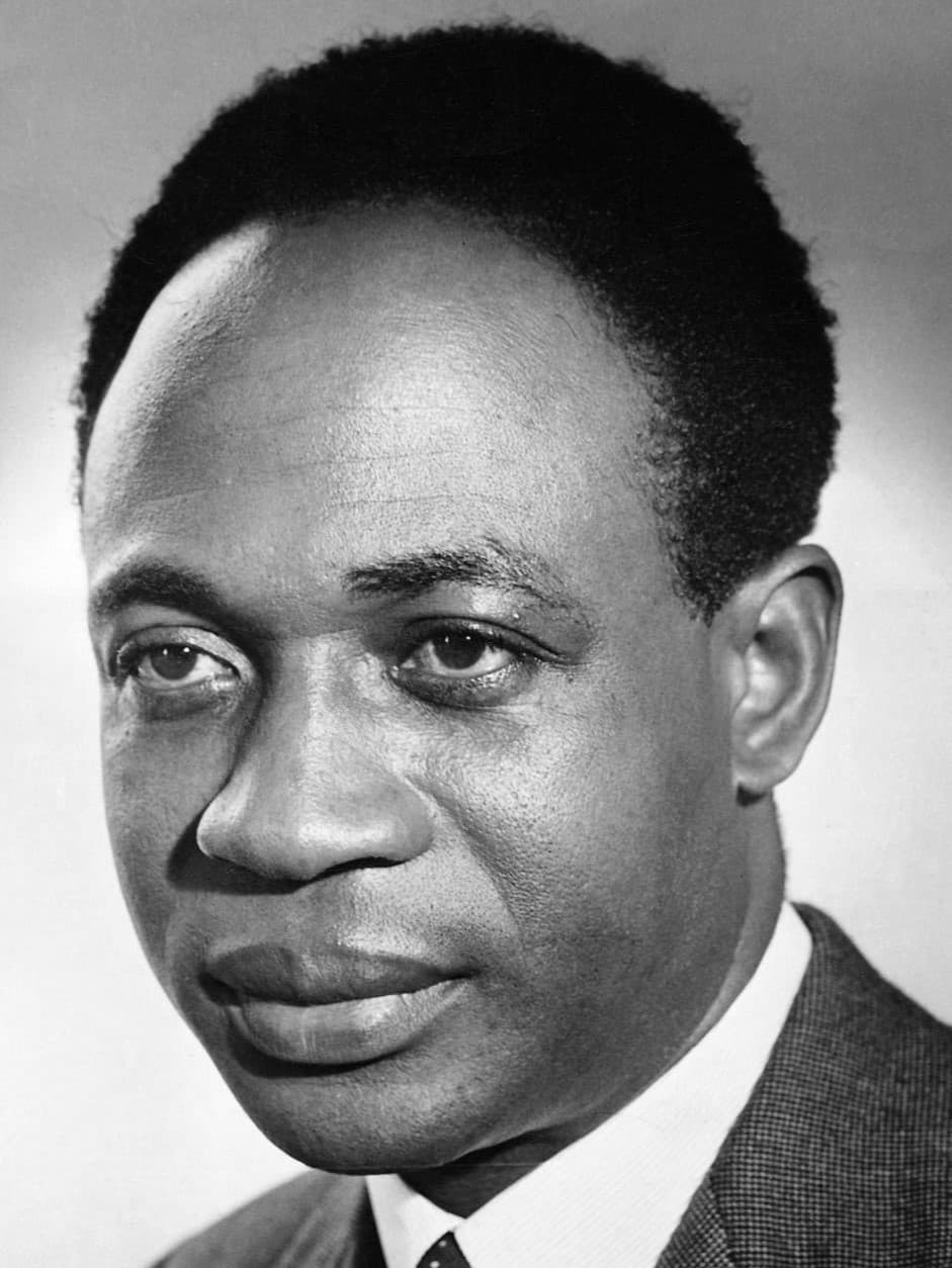 A formal portrait of Kwame Nkrumah in dark suit and striped tie
