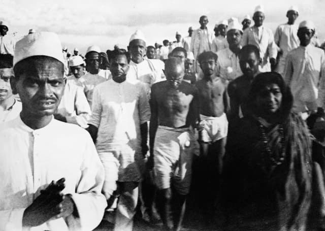 Gandhi and marchers walking on the salt road to Dandi in 1930