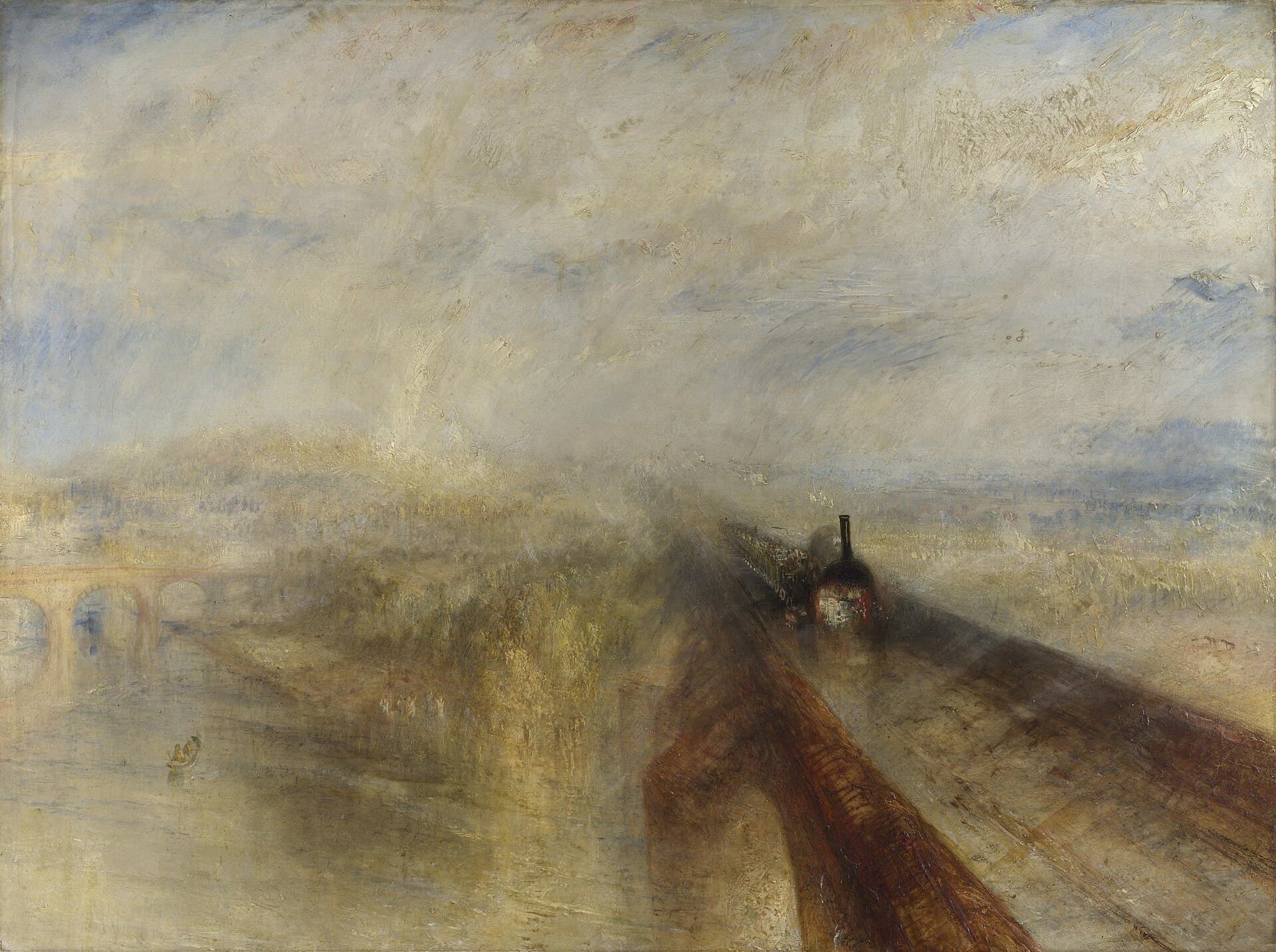 A steam locomotive crosses a great railway bridge toward the viewer through rain